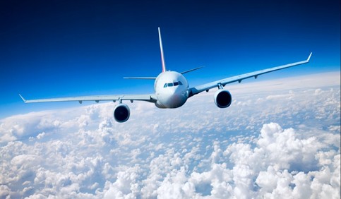 airplane flying above clouds