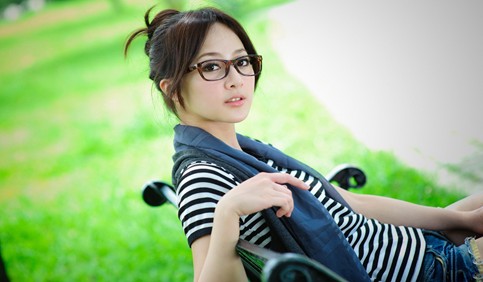 beautiful girl with specs on chair